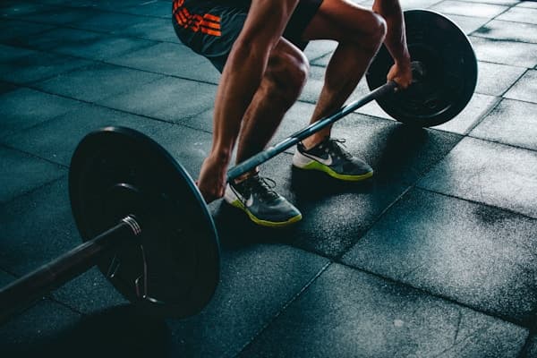 Athlete training with sports nutrition and fitness diet